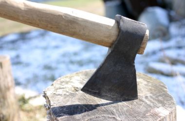 axe on a stump of wood